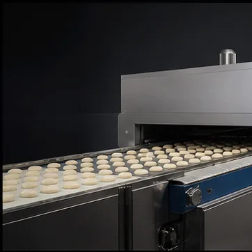 Commercial tunnel oven and continuous bakery product flow in a technical production setting
